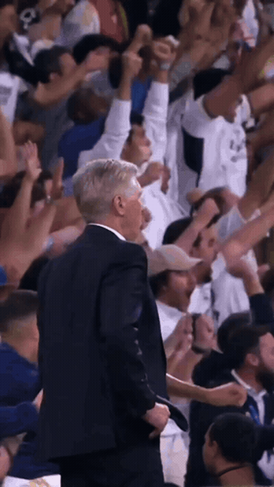 Man In Suit At Microphone Saying King's Back GIF
