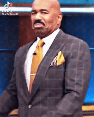 Man In Suit At Microphone GIF