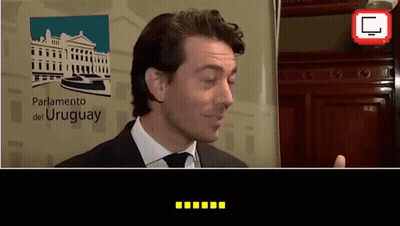 Man In Suit At Parliamento Del Uruguay Sign GIF