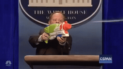 Man In Suit At Podium GIF