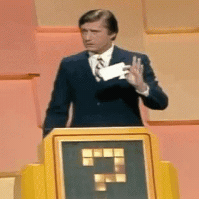 Man In Suit At Podium Holding Paper And Thumbs Up GIF