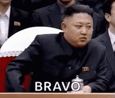 Man In Suit At Podium Saying Bravo GIF