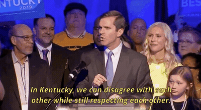 Man In Suit At Podium Says In Kentucky GIF