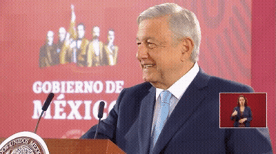 Man In Suit At Podium With Gobierno De Mexico Sign GIF