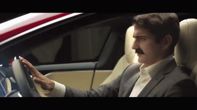 Man In Suit At Podium With Money Falling Brrr GIF
