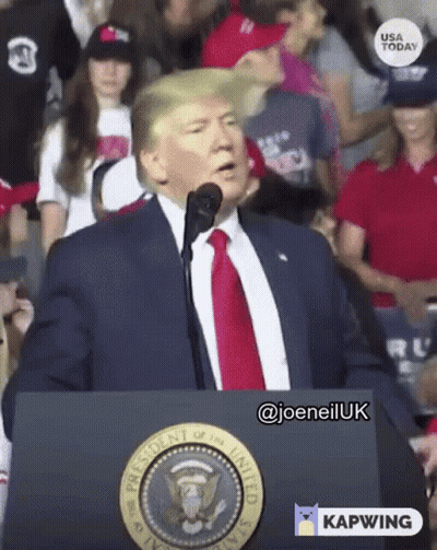Man In Suit At Podium With Presidential Seal GIF