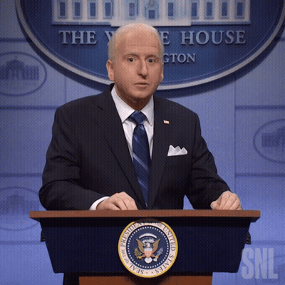 Man In Suit At Presidential Podium GIF
