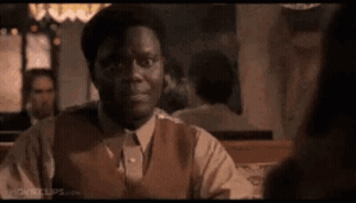 Man In Suit At Restaurant Table GIF