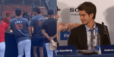 Man In Suit At Table With Sign Saying Andrew Eisenberg GIF