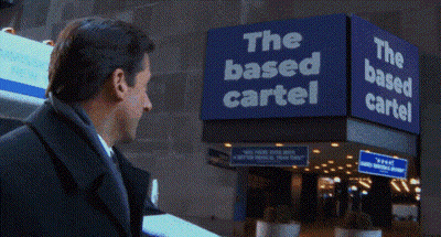 Man In Suit At The Based Cartel Sign GIF