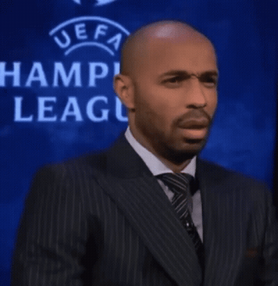 Man In Suit At UEFA Champions League Sign GIF