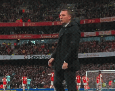Man In Suit Before Arsenal.com Ad GIF