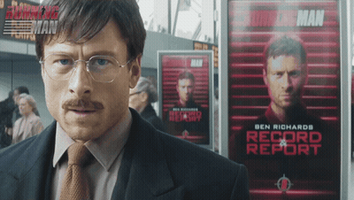 Man In Suit Before Ben Richards Record Report Poster GIF