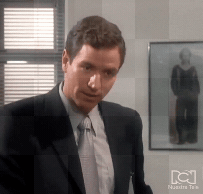 Man In Suit Before Woman Photo Nuestra Tele GIF