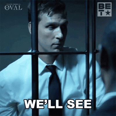 Man In Suit Behind Bars Saying We'll See GIF
