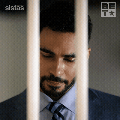 Man In Suit Behind Bars Sistas GIF