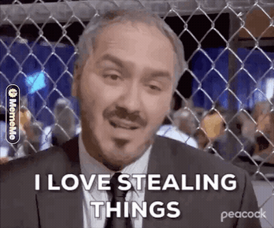 Man In Suit Behind Chain Link Fence GIF