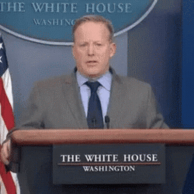 Man In Suit Behind Podium At White House GIF