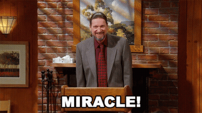 Man In Suit Behind Podium Saying Miracle GIF