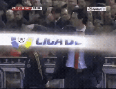 Man In Suit Beside Livad Sign GIF