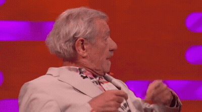 Man In Suit Beside Man In Black Suit GIF