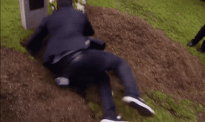 Man In Suit Buried In Dirt GIF