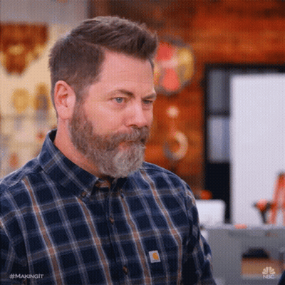 Man In Suit By Trophy Wall GIF