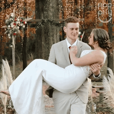 Man In Suit Carrying Woman In White Dress GIF