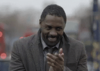 Man In Suit Clapping And Smiling GIF