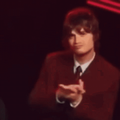 Man In Suit Clapping By Building With B GIF