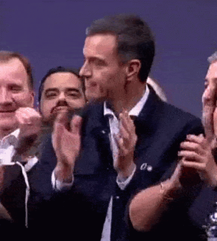 Man In Suit Clapping In Crowd GIF