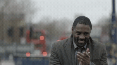 Man In Suit Clapping In Front Of Bus GIF