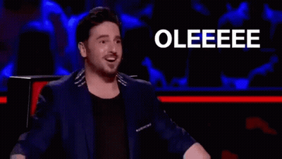 Man In Suit Clapping In Front Of Crowd GIF