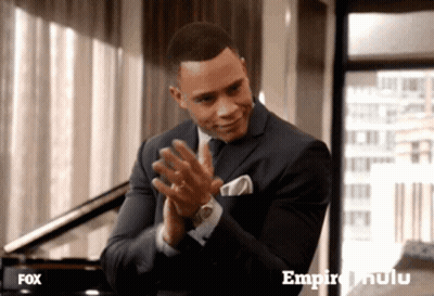 Man In Suit Clapping In Front Of Fox Advertisement GIF