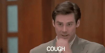 Man In Suit Coughing While Sitting In Chair GIF