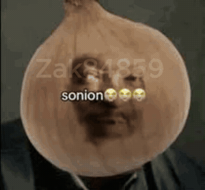 Man In Suit Covered In Onion With Smiley Face GIF