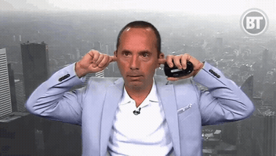 Man In Suit Covering Ears In Front Of BF Logo GIF