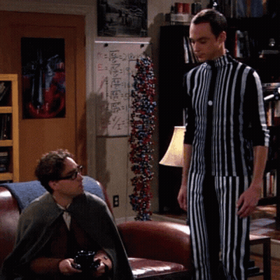 Man In Suit Covering Face, Another Looking On GIF