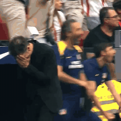 Man In Suit Covering Face Beside Safety Vest Man GIF
