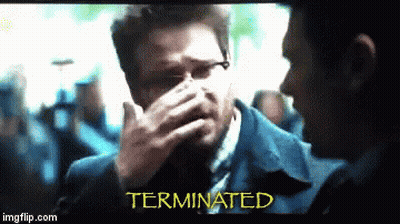 Man In Suit Covering Face Terminated GIF