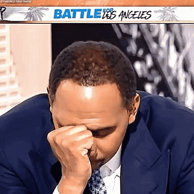 Man In Suit Covering Face GIF
