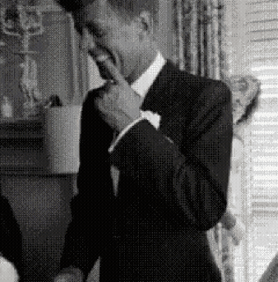 Man In Suit Covering Mouth GIF