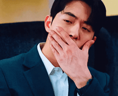 Man In Suit Covering Mouth GIF