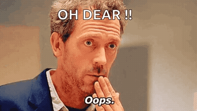 Man In Suit Covering Mouth Making Funny Face GIF
