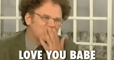 Man in Suit Covering Mouth Saying I Love You Babe