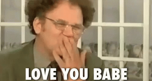 Man in Suit Covering Mouth Saying Love You Babe