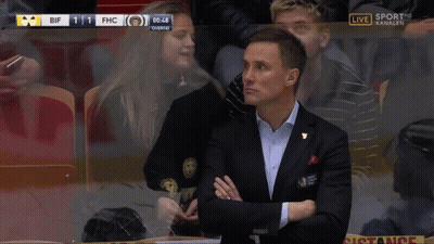 Man In Suit Covering Mouth Watching Sports GIF
