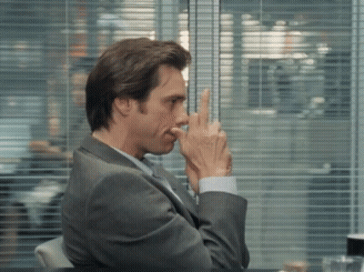 Man In Suit Covering Nose GIF