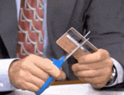 Man In Suit Cutting Credit Card With Scissors GIF