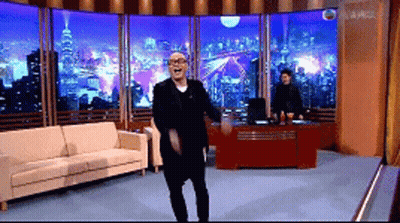 Man In Suit Dancing By Couch GIF
